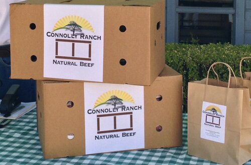 Two stacked boxes of the packaged, frozen Connolly Ranch beef with labels visible. 